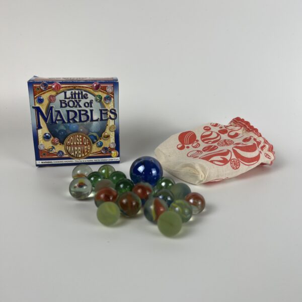 This image shows the variety of marbles and bag included within the box.