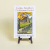 This image shows the cover of Gustav Stickley's Craftsman Farms: A Pictorial History on a book stand