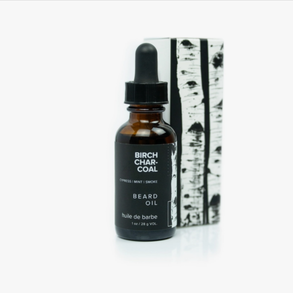 This image shows the beard oil and its packaging.