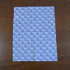 This is the light blue tea towel in the Leaf and Berry pattern