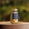 This image shows the Down and Dirty Mule Cocktail Infusion Mix on top of a wine barrel.