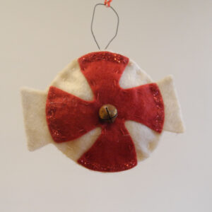 This image shows the felt ornament featuring a peppermint shape.