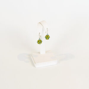 This is a pair of green and blue dangly earrings. The beads have been woven in a way that creates a cluster of beads topped with a silver bead above and below the cluster.