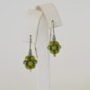 This is a detail shot of the Sheila Fernekes Mulberry Earrings that highlights the way the green and blue beads were strung together to created the earrings.