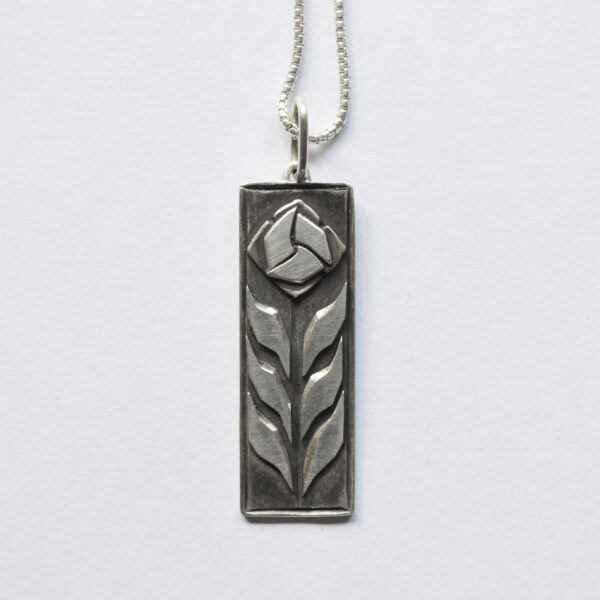 This image shows a close up of the Craftsman Rose pendant.