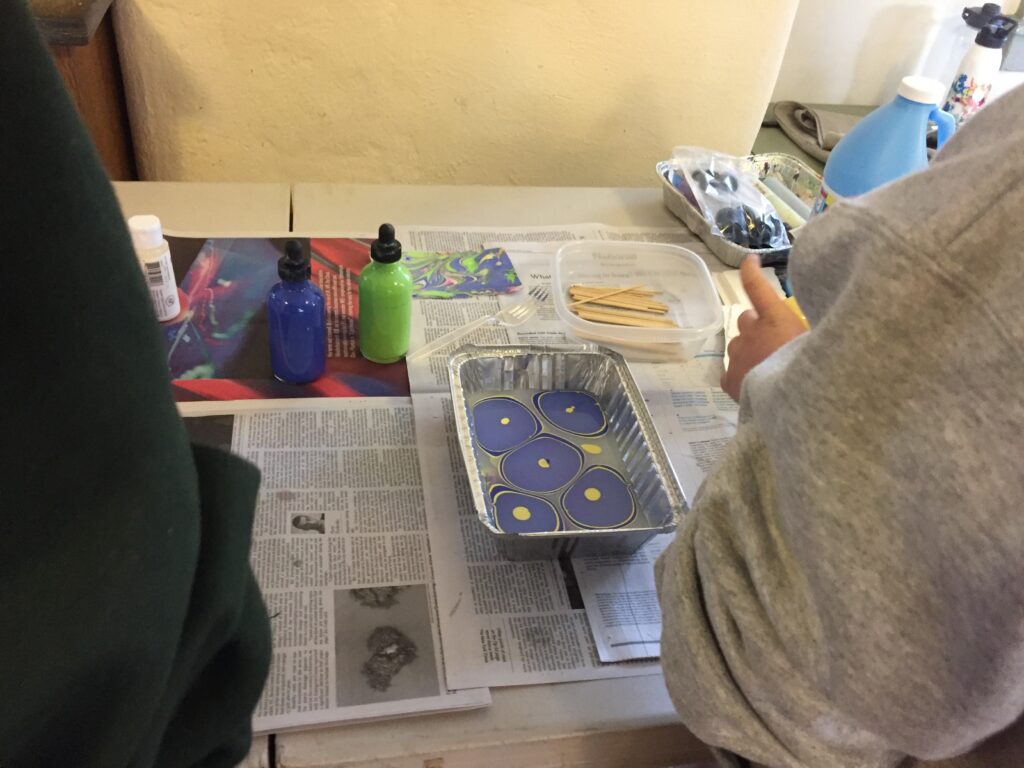 Paper Marbling during a Cadette Girl Scout Book Arts badge workshop, February 16, 2020