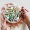 This image shows the Blissful Blooms Embroidery Kit while in process.