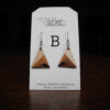 This image shows a close up of Kurt Meyer's earring labeled "B".