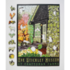 This image shows the puzzle featuring Julie Leidel's print The Stickley Museum at Craftsman Farms. Various "whmisy" puzzle pieces or irregular shaped puzzle pieces are along the left side of the puzzle. Some of the "whimsies" include a pig, rooster, owl with its wings spread, a mapple leaf, flower, tractor and more.