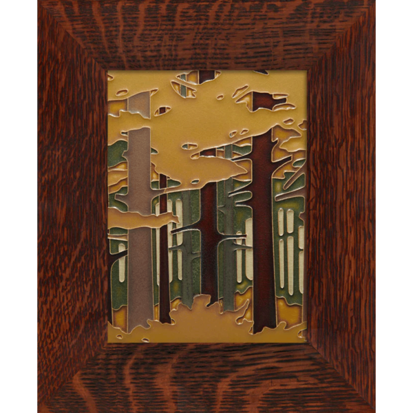 This image shows the Autumn Woodland tile created by Motawi. It is framed in a brown oak frame.