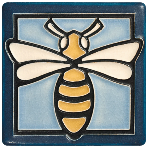 This tile shows the light blue Motawi tile in a bee design.