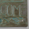 This detail shot shows how the glaze pools in the recessed areas of the plaque.