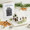 This image shows the contents of the Gingerbread House Cookie Cutter Book Box and a potential way you can design your Gingerbread House.