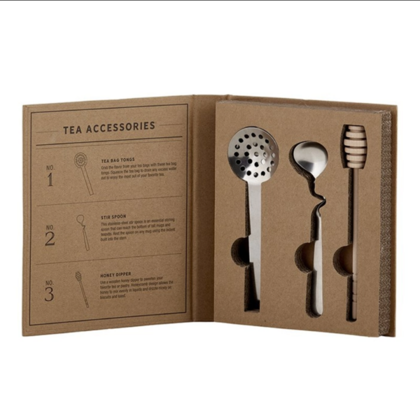 This image shows the tea stirrer, strainer and honey stick in the Tea Accessory Book Box.