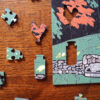 This image shows a detail of the rooster and glass milk bottle in the puzzle featuring Laura Wilder's print.